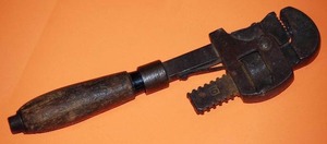 lot 15 image: Antique wooden handle  pipe wrench