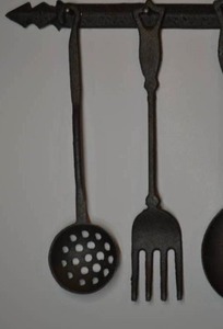 lot 100 image: cast iron hanging flatwear decor