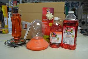 lot 118 image: Hummingbird Nectar, Oriole Nectar, Glass Oriole Feeder, and Plastic Oriole Feeder