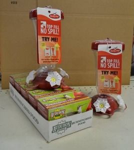 lot 119 image: (2) Hummingbird Feeders with 5 Packs of Nectar Mix