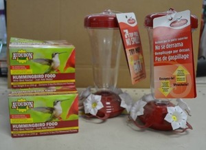 lot 120 image: (2) Hummingbird Feeders with 5 Packs of Nectar Mix