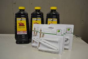 lot 131 image: (3) Bottles Citronella Tiki Torch Fuel  (4) Replacement Wicks