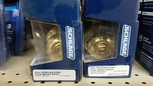 lot 1594 image: (2) Schlage Bed & BathKeyed Entry Doorknobs - Bright Brass