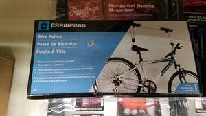 lot 1064 image: Rawlings Horizontal Sports Storage System and Crawford Hanging Bike Pulley