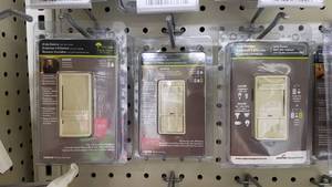 lot 1243 image: (9) Cooper  Eaton Programmable Timers and Slide Dimmer Switches