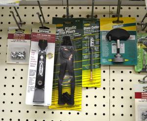 lot 1118 image: Glass  Plastic  Tile Cutters , Hook Driver and More
