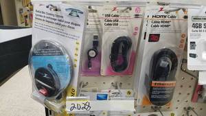 lot 2028 image: Inventory of Universal Remote Controls, Audio  Video Cables, 4 GB SD Card, and More