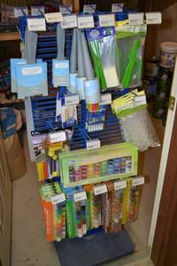 lot 850 image: Rack Contents - Craft Paint Brushes, Craft Paint Tools, Glass Markers, Acrylic Paint Pots, Empty Paint Pot Cups