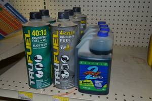 lot 720 image: (5) Cans TRUFUEL 32oz Each , (4) Bottles 2 Stroke Oil 19.6oz Each