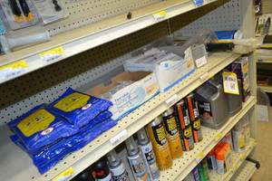lot 792 image: Contents of Shelf Wipes, Syringes, Plastic Sheeting Roller and More