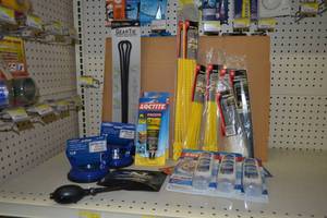 lot 766 image: Suction Cup Handles, (8) Packages of Zip Ties  Bead Tiesand Assorted Caulk and Adhesive