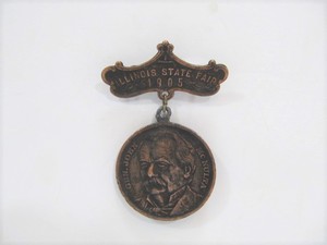 lot 69 image: Antique 1905 Illinois State Fair Badge - General John McNulta Military Valor 