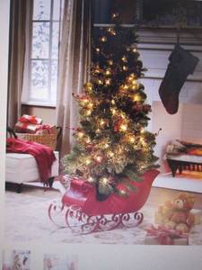 lot 12 image: 4-Ft. Tree in Red Sled open box Ret...