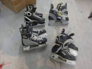 4 Pair Hockey Skates sizes unknown...