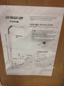 lot 1 image: Lavish Home 60 in. Black LED Sunlight Floor Lamp with Dimmer Switch in good condition