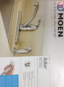 lot 98 image: MOEN Adler Single-Handle Low Arc Standard Kitchen Faucet with Side Sprayer in Chrome in good condition