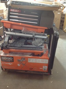 lot 23 image: Pallet of assorted tools Tile saw,tools boxes,shells and more costumers returns