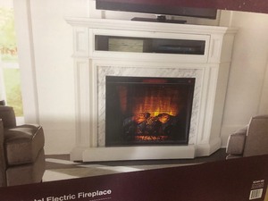lot 36 image: Home Decorators Collection Charice 57 in. Freestanding Infrared Electric Fireplace in White with Carrara Marble Surround customer returns