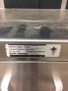 lot 78 image: SMITH NEPHEW STAINLESS STEEL CART 1 DRAWER - NEEDS A LITTLE DUSTING BUT IN REALLY GREAT CONDITION OTHERWISE