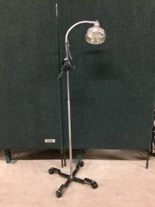 lot 59 image: Chrome Medical Retro Light Lamp On Wheels