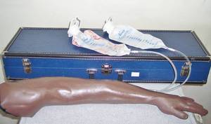 lot 92 image: MSRP $600 Nasco Life Form Venipuncture and Injection Arm - Great Condition With Case