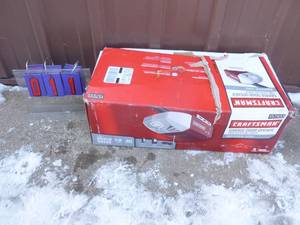 Craftsman garage door opener. Box was open but appears complete although may be missing some hardware As shown.