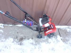 Craftsman 2 cycle mini tiller. Looks nearly new. Runs on ether. As shown.
