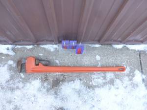 48 Cast pipe wrench. New condition. As shown.