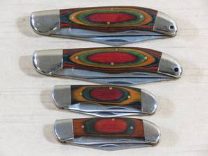 lot 25 image: (4) Fancy Wood Pocket Knives