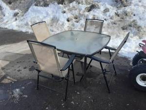 lot 4 image: Glass Top Patio Table & 4-Folding Chairs (1-Ripped)