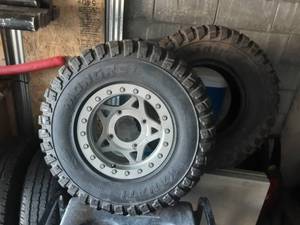 lot 13 image: Pair Of Kanati Mongrel 30x10-R14 ATV Tires 1-Brand New, 1-Like New On Walker -Evans Beadlock Rim