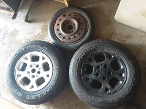 lot 15 image: Pair Of Jeep Aluminum 5 Bolt Wheels & 1 Donut