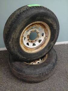 lot 214 image: Lot of (2) ST23580R16 Trailer Tires with 16in. 8-Lug White Steel Wheels