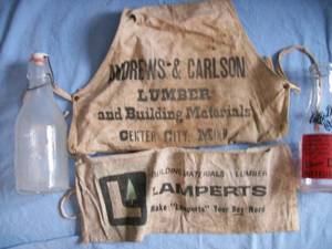 Center City MN Nail Apron with 2 milk bottles. As shown.