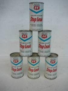 lot 13 image: Phillips 66 Stop Leak unopened cans