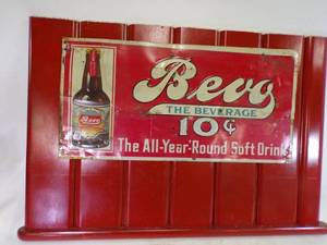 lot 42 image: Bevo Beverage Sign mounted on wood