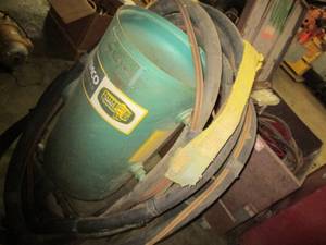 Sandblaster with cabinet of hoses a...