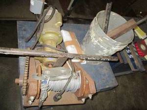 Winch and pail of assorted hardware...