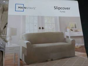 lot 76 image: 2 Love Seat Slip Covers...