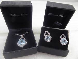 lot 87 image: Brand New Womens Three Piece Platinum Plated Crystal & Blue Gem Pendent and Earring Set