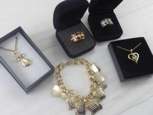 lot 91 image: Brand New Seven Piece Stainless Steel Necklaces, Pendants Bracelet & Two Size 12 Rings