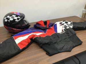 lot 3 image: Womens Snowmobile Polaris Helmet and Jacket.