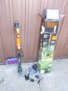 Black & Decker 20 volt lithium weed trimmer with battery & charger. Nearly new. Tested & works. As shown.