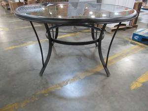 lot 218 image: Hampton Bay Round Aluminum and Smoke Glass Patio Table With Umbrella Hole - Slight Dent on table top.