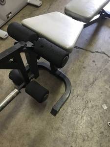 Adjustable flat to incline bench with leg curl,  extention attachment