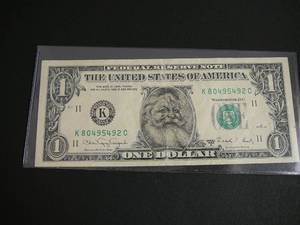 lot 61 image: $1 Santa Face Bill Green Seal