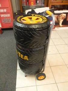 lot 1 image: TWISTED TEA TIRE CART COOLER - VERY COOL - NEVER USED - APPROX 36 BY 18 - SEE PICTURES