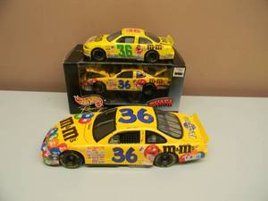 lot 19 image: ACTION 118 SCALE #36 m&m NASCAR 1999, NICE - SELECT VEHICLES HOT WHEELS RACING 124 SCALE #36 m&m NASCAR 1999, VERY DETAILED - NEW IN BOX - RACING CHAMPIONS 124 SCALE #36 m&m NASCAR - NICE COLLECTION - SEE PICTURES