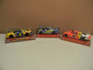 lot 28 image: RACING CHAMPIONS 124 SCALE DIE CAST KYLE BUSCH 2005 COLLECTOR SERIES -  RACING CHAMPIONS 124 SCALE DIE CAST RICKY CRAVEN 2003 COLLECTOR SERIES - RACING CHAMPIONS 124 SCALE DIE CAST JIMMIE JOHNSON 2003 COLLECTOR SERIES - NEW IN BOX - SEE PICTURES