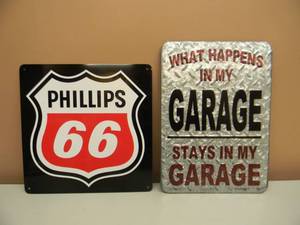 lot 30 image: 2 TIN SIGNS - PHILLIPS 66 APPROX 12 BY 12 - WHAT HAPPENS IN MY GARAGE STAYS IN MY GARAGE APPROX 10 BY 14 - NICE - SEE PICTURES